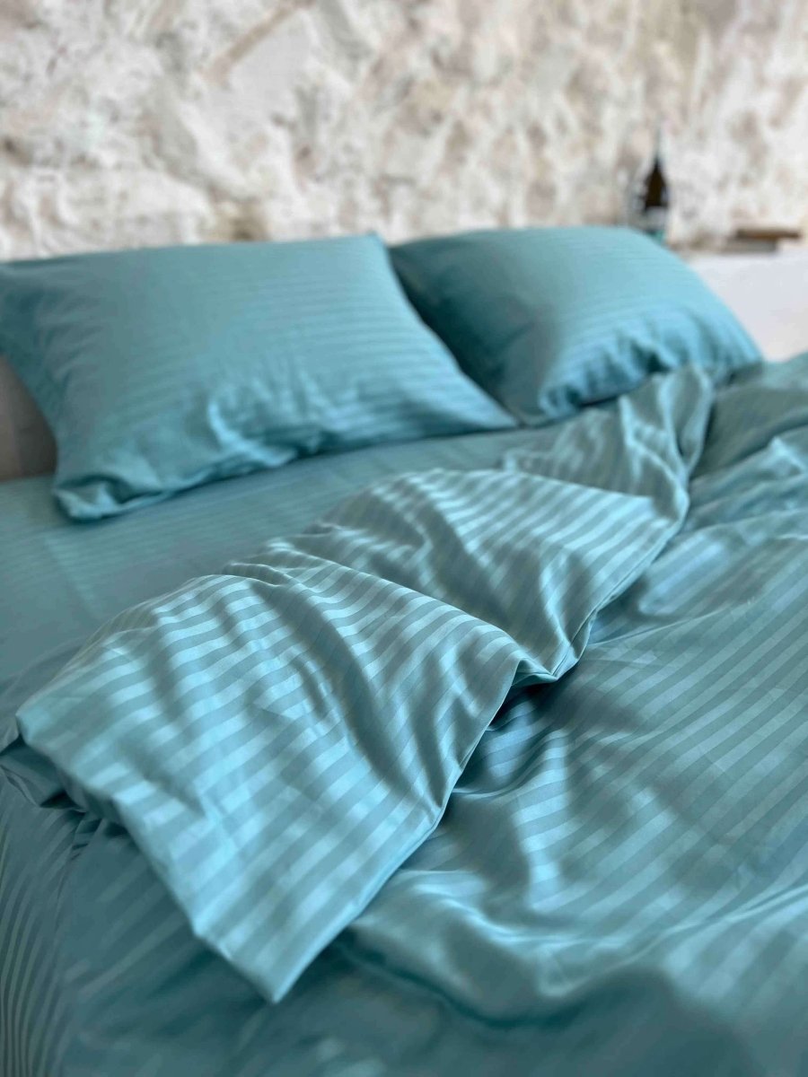 Satin bedding with turquoise stripes
