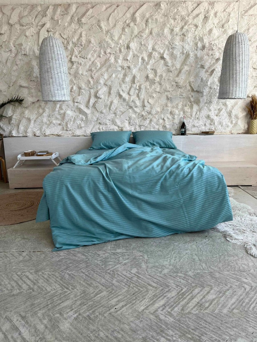 Satin bedding with turquoise stripes