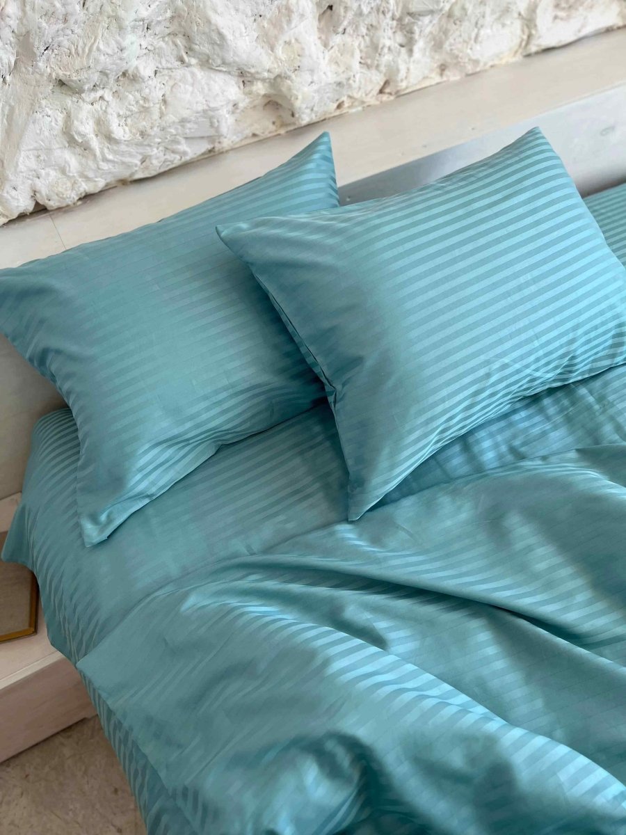 Satin bedding with turquoise stripes